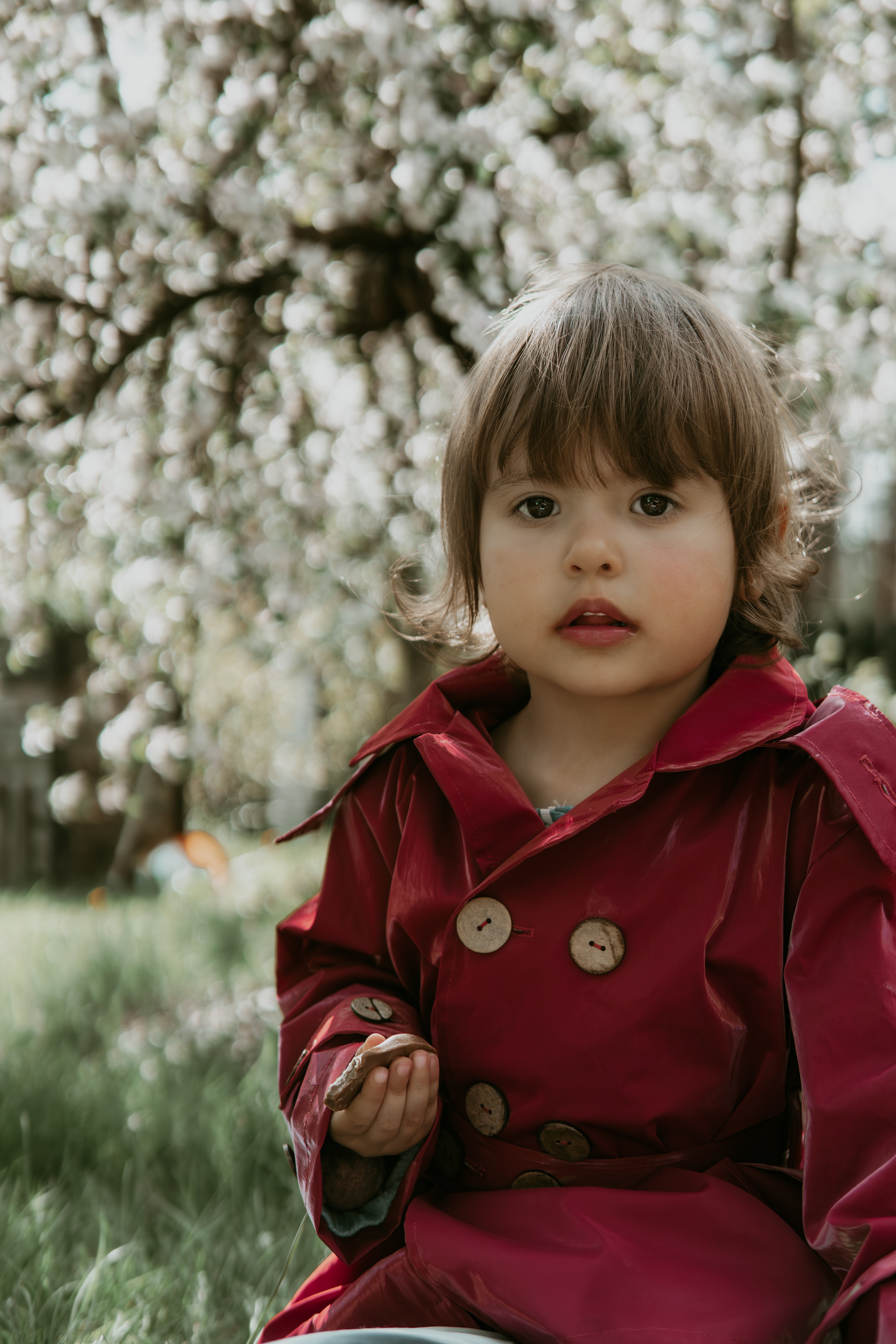 Girl wearing a rich burgundy cotton-linen trench coat by ZUBEK. Plastic-free, breathable, and toxin-safe outerwear designed for kids.
